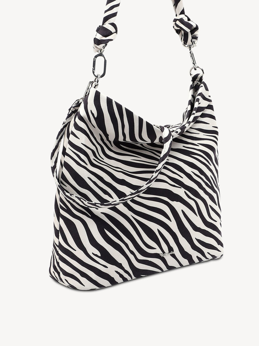 Close-up van zijkant zebra handtas met opvallende knoopriem