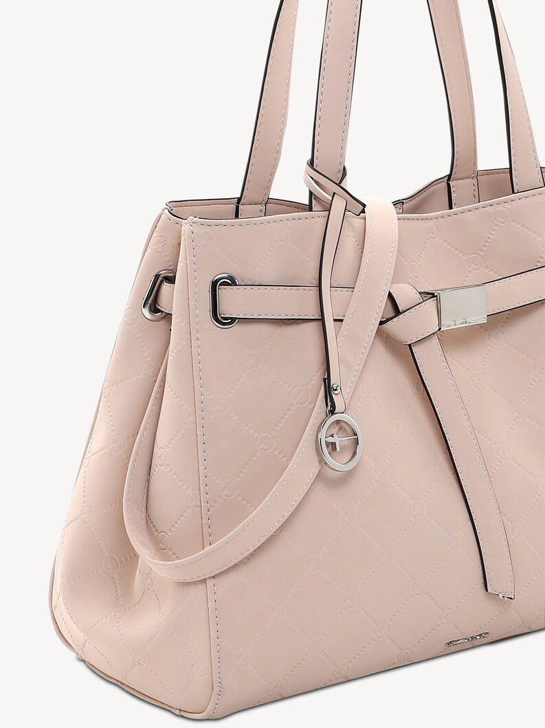 Close-up of pink women's faux leather handbag with quilted pattern and metal charm