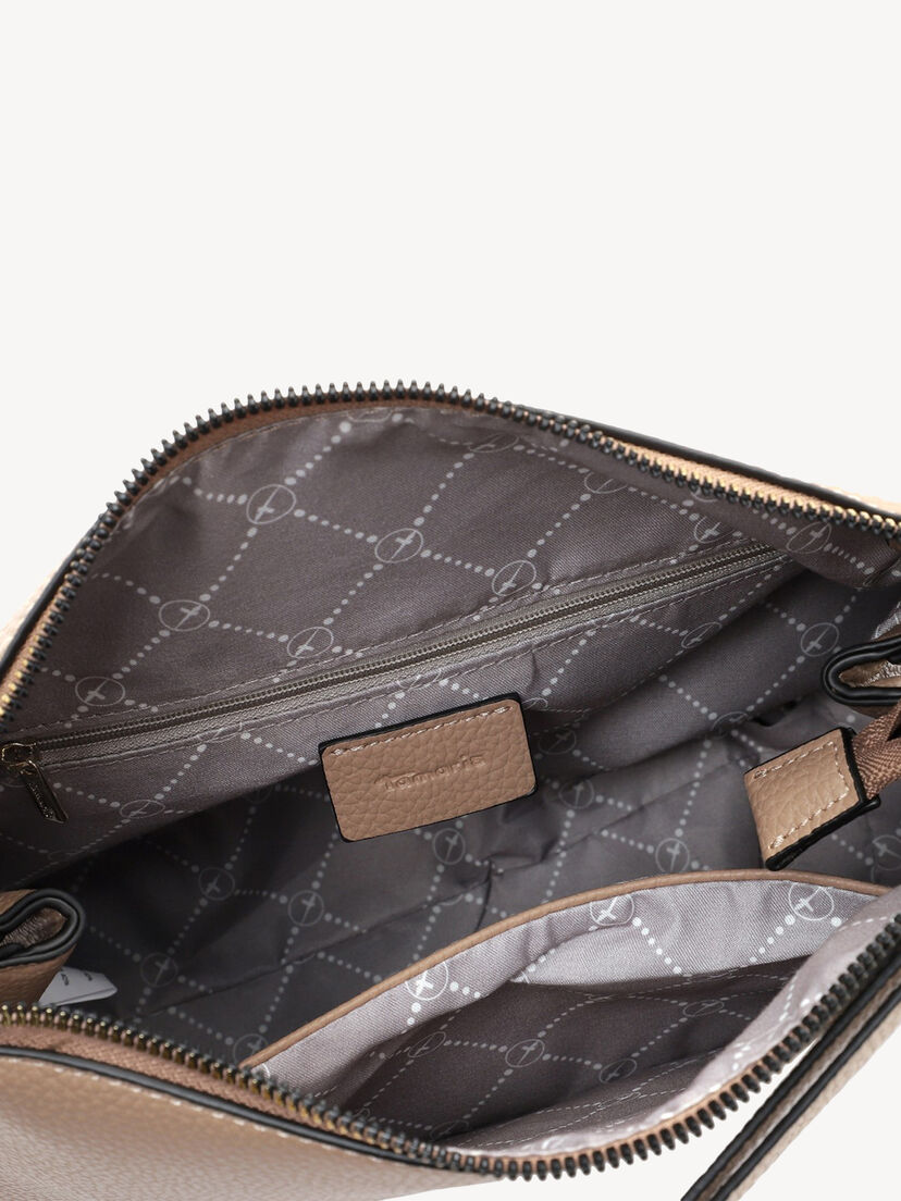 Close-up van beige handtas interieur met ritsvak