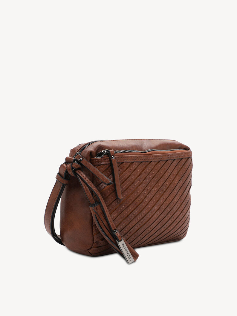 Vue de c&ocirc;t&eacute; d&rsquo;un sac bandouli&egrave;re en cuir marron avec pompons d&eacute;coratifs