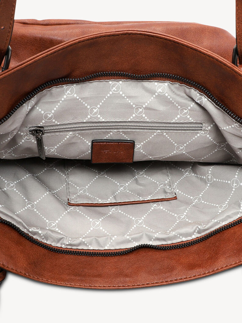 Interior of brown leather handbag with zipper and patterned lining