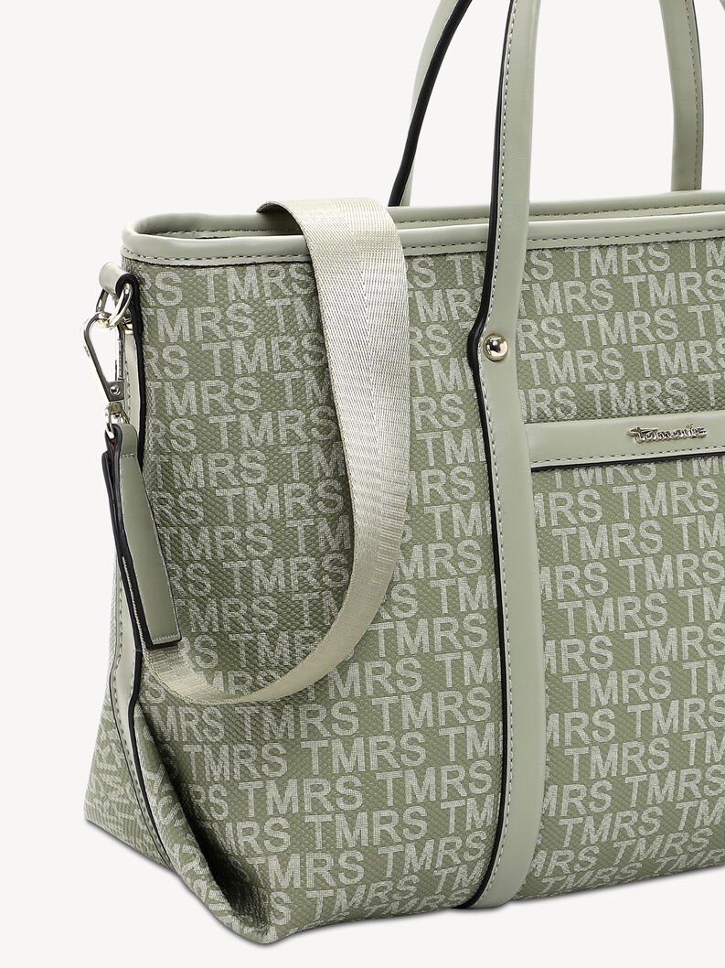 Detail of green bag with detachable strap and metal clasps