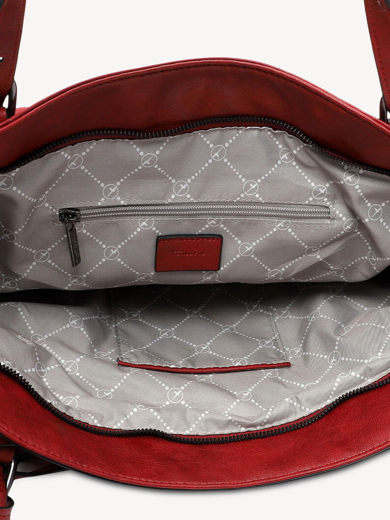 Interior detail of red leather handbag with zipper pocket