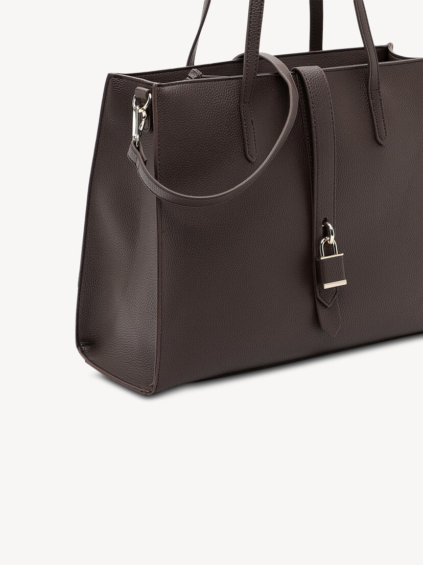 Detail van donkerbruine leren damestas met decoratief slot