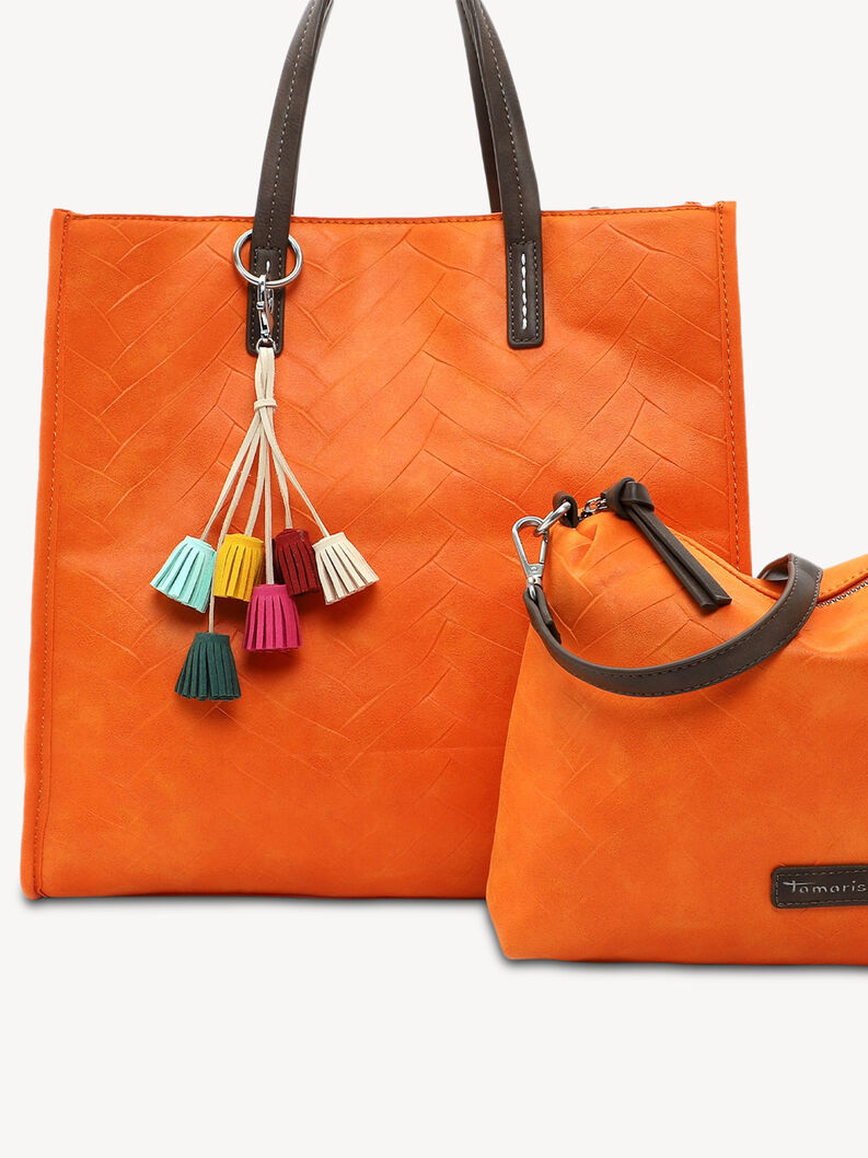 D&eacute;tail sac &agrave; main cuir orange avec pompons color&eacute;s et petit sac