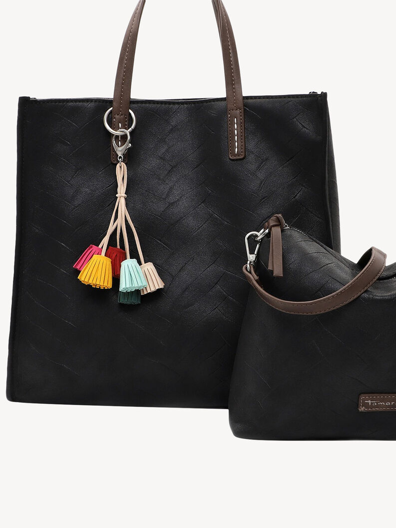 Detailansicht einer schwarzen Tasche mit bunten Quasten und braune Tasche daneben