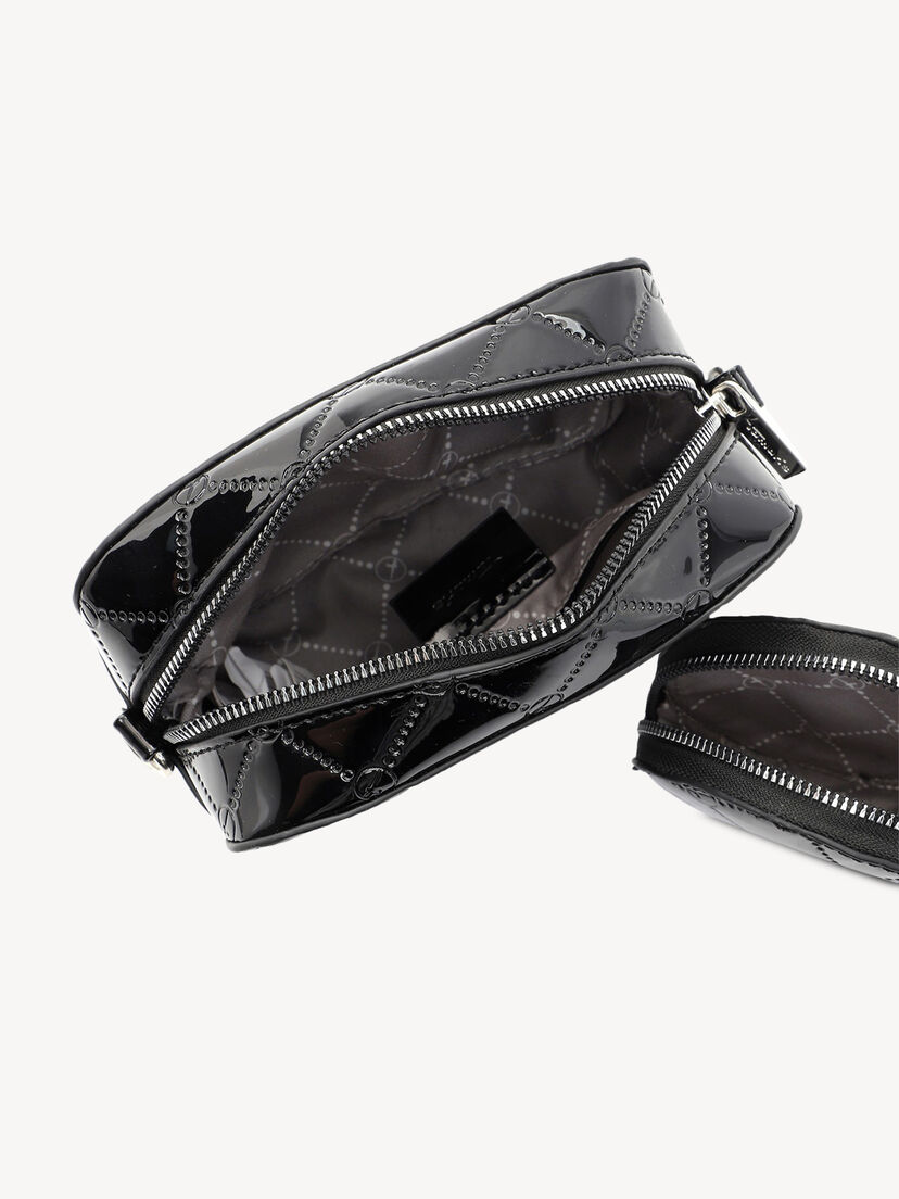 Detail van open glanzende zwarte tas met bedrukte stof voering