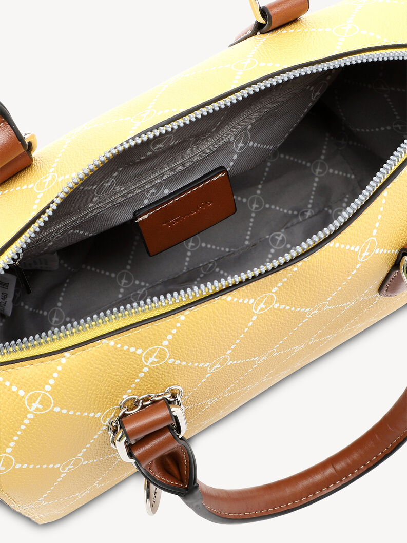 Zbliżenie wnętrza ż&oacute;łtej torebki z białym wzorem i zamkiem